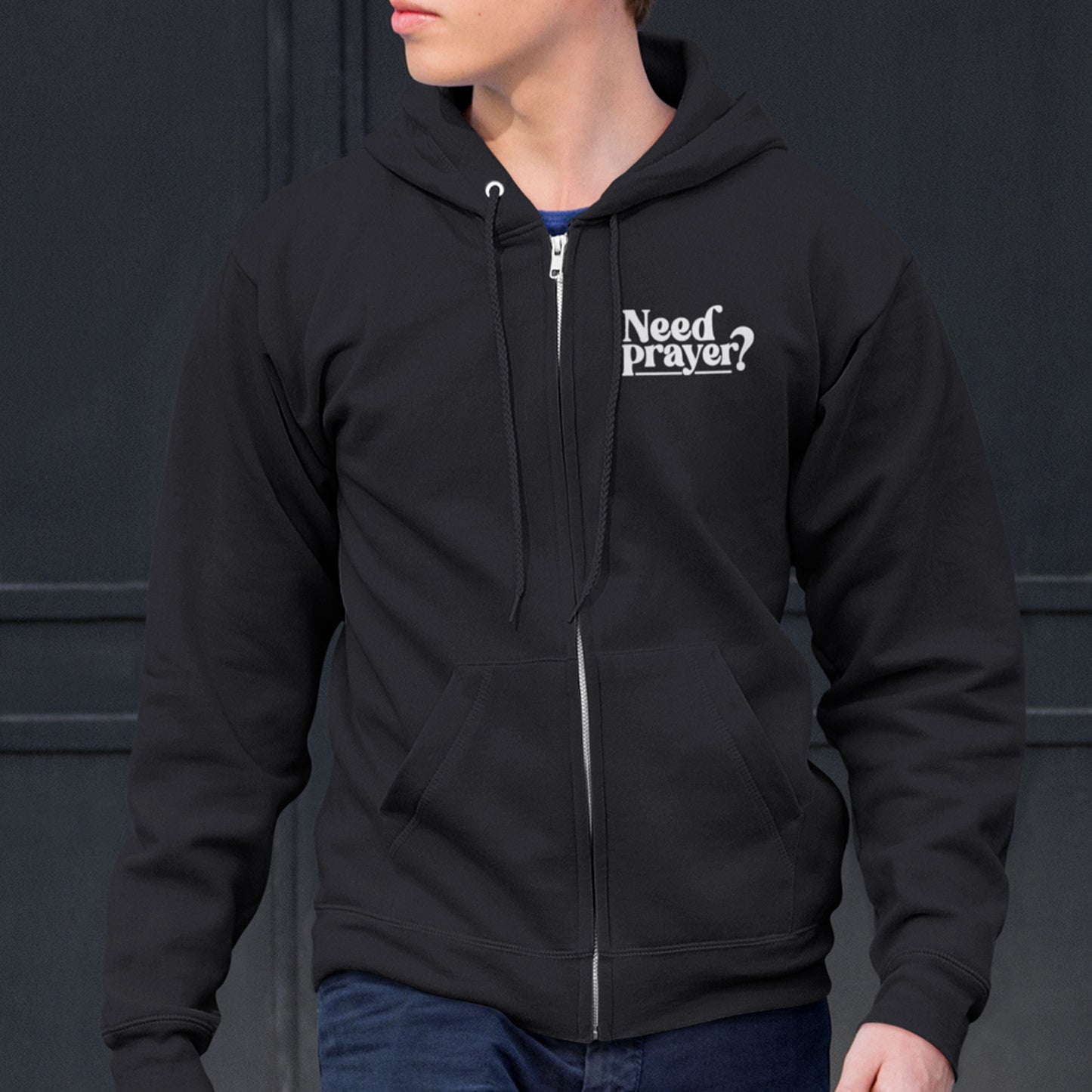 Black zip-up Christian hoodie with “Need Prayer?” chest print, unisex oversized fit