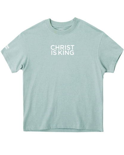 Light blue t-shirt with 'CHRIST IS KING' text on a white background